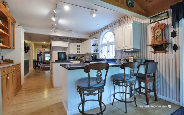 a view of a dining room with furniture and a large window