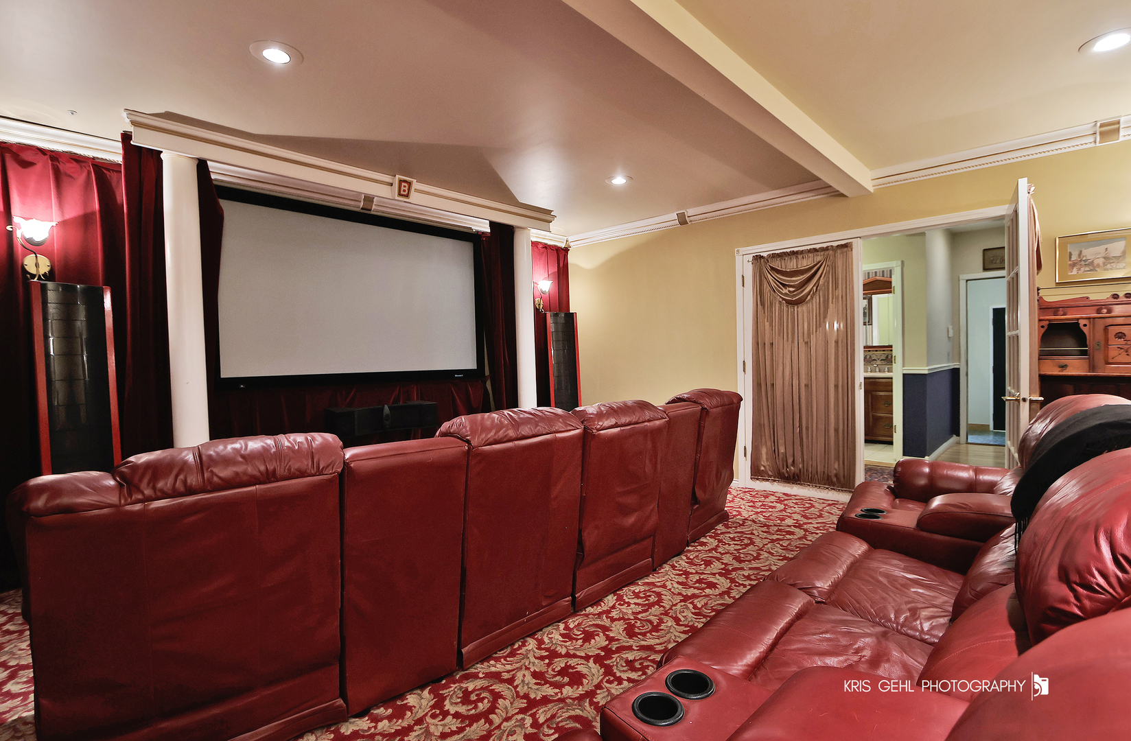 2214 Main Street Road Spring Grove, IL 60081 - Photo 20 of 53 a living room with furniture a projector and flat screen