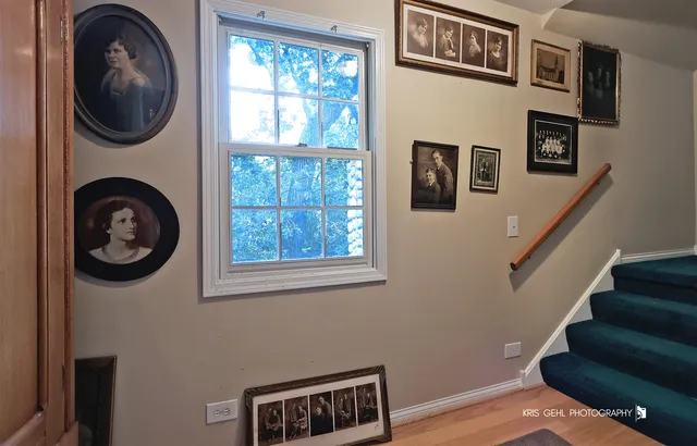 a bedroom with furniture and a rug