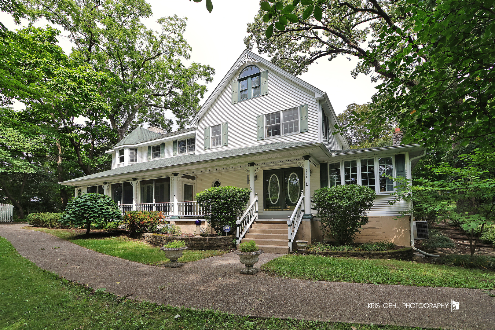 2214 Main Street Road Spring Grove, IL 60081 - Photo 4 of 53 a front view of a house with a yard and potted plants