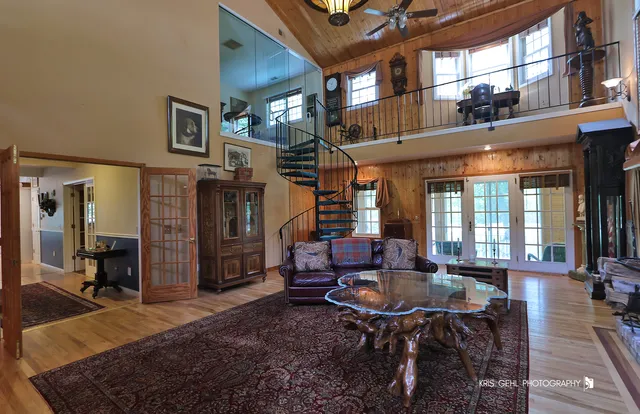 a living room with furniture a window and kitchen view