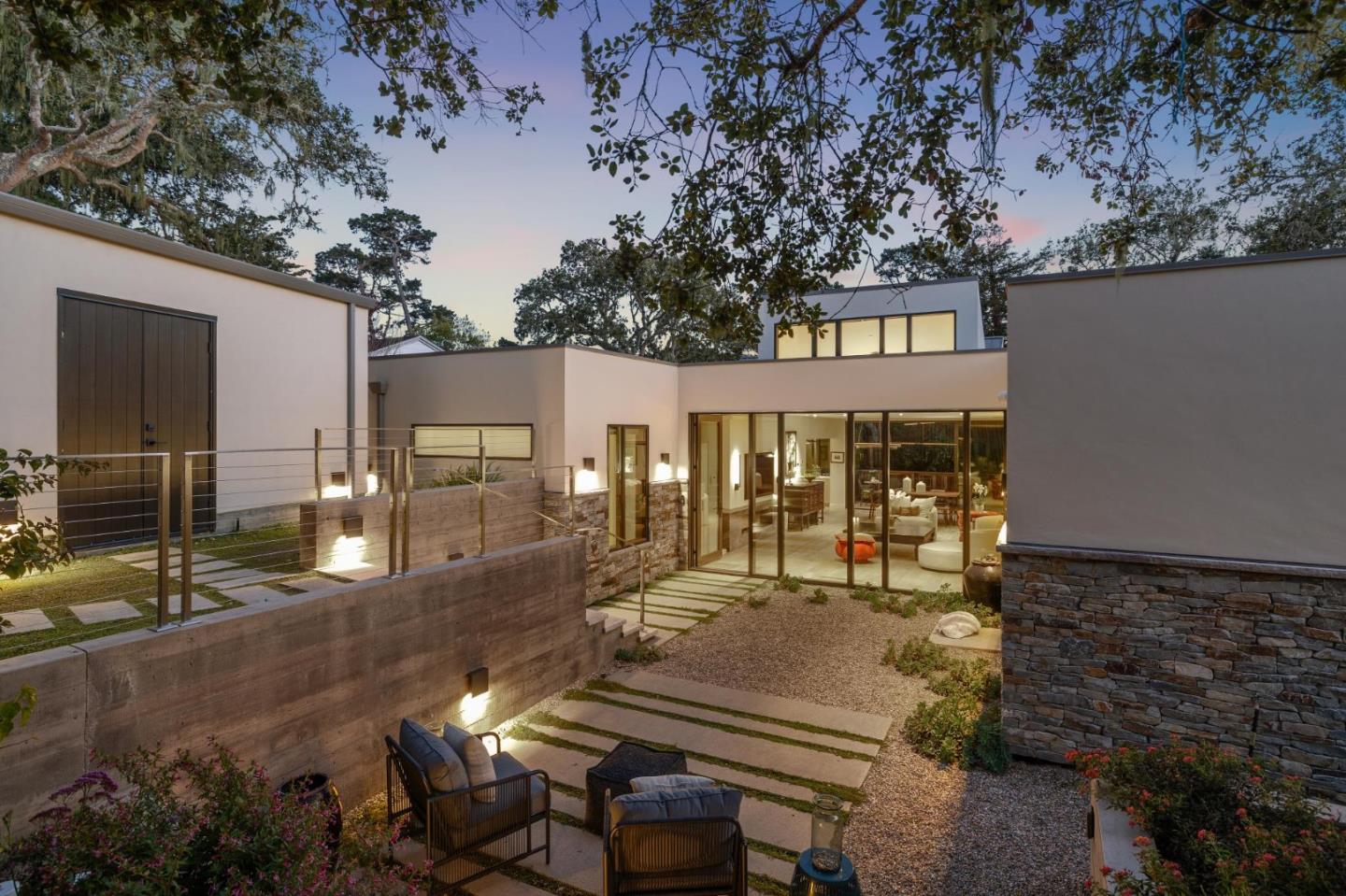 a view of a patio with table and chairs with wooden fence and plants
