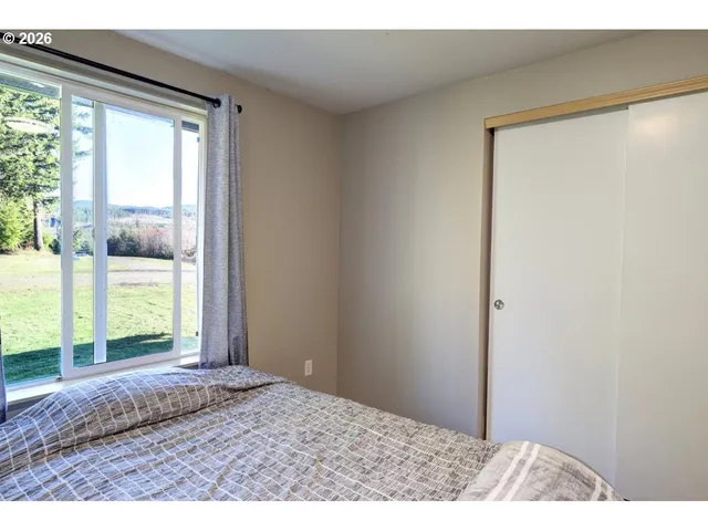 a bathroom with a granite countertop sink a toilet and a shower