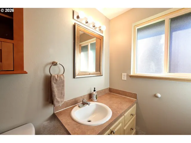 a bed room with a bed and a ceiling fan