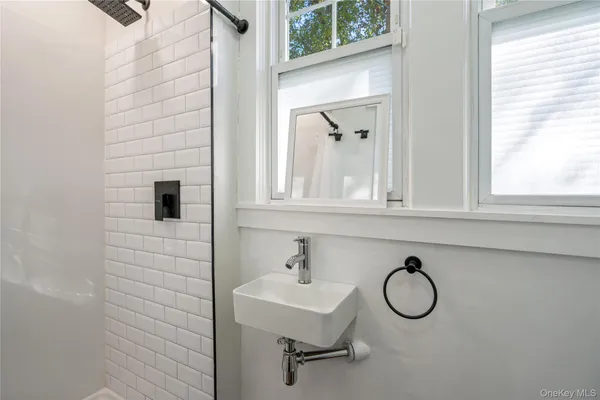 a bathroom with a sink and a window