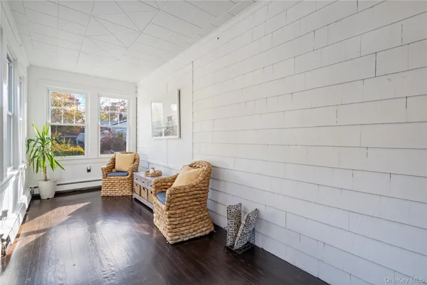 a living room with furniture and windows