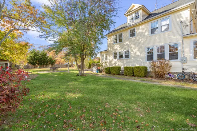 a view of a building with a yard