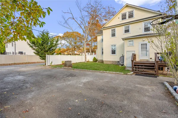a view of a house with a yard and garage