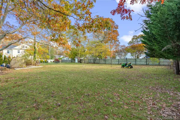 a view of outdoor space with deck and trees