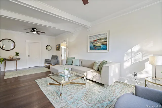 a living room with furniture and a clock