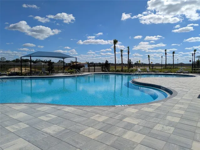 a view of a patio with a table and chairs