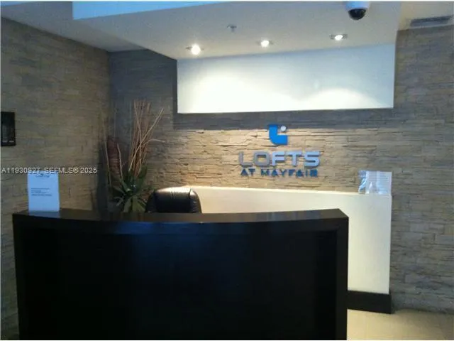 a kitchen with a sink and a refrigerator