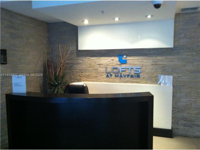 3339 Virginia Street, Unit 124 Miami, FL 33133 - Photo 1 of 4 a kitchen with a sink and a refrigerator