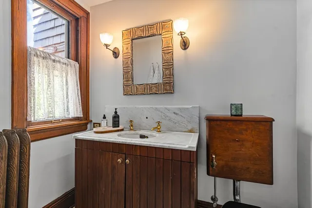 a bathroom with a sink and a mirror
