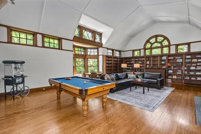 a living room with furniture a rug and a window