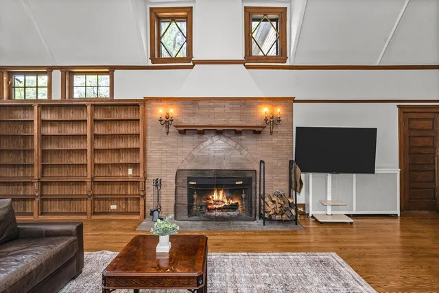 a living room with furniture and a fireplace