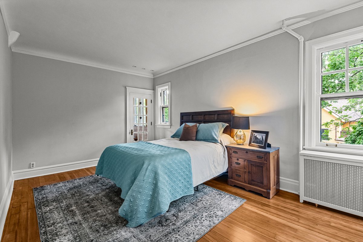 225 Hamilton Street Evanston, IL 60202 - Photo 23 of 38 a bedroom with a bed and wooden floor