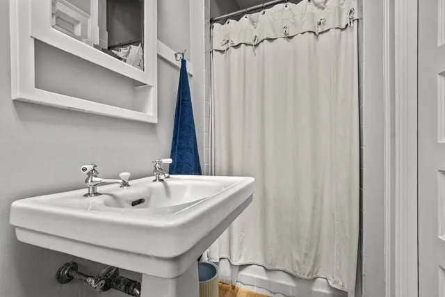 a bathroom with a sink and a mirror