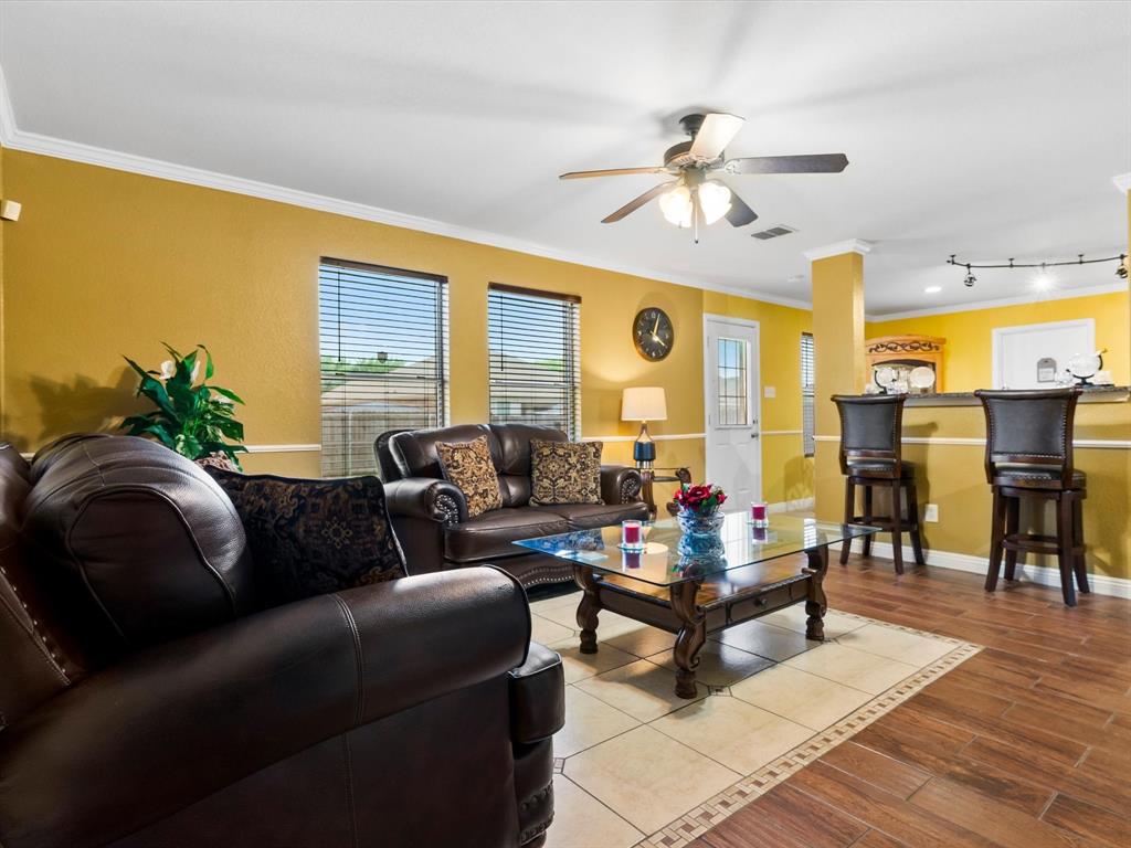 1129 Switchgrass Lane Crowley, TX 76036 - Photo 12 of 40 a living room with furniture and wooden floor