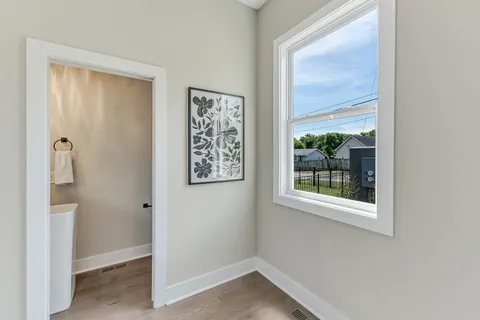 a view of entryway with wooden floor and stairs
