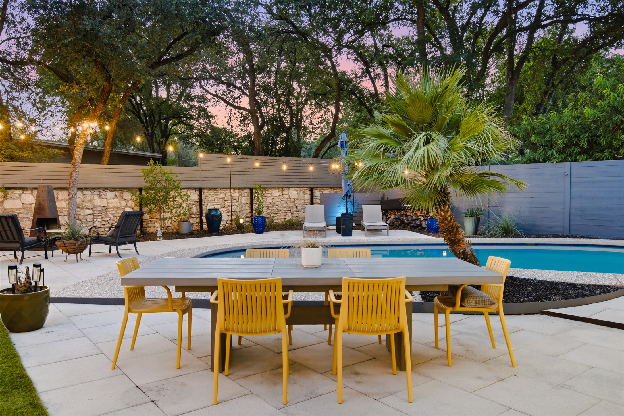 412 Ridgewood Road West Lake Hills, TX 78746 - Photo 35 of 40 Outdoor dining area overlooking the pool, home and artificial turf yard.