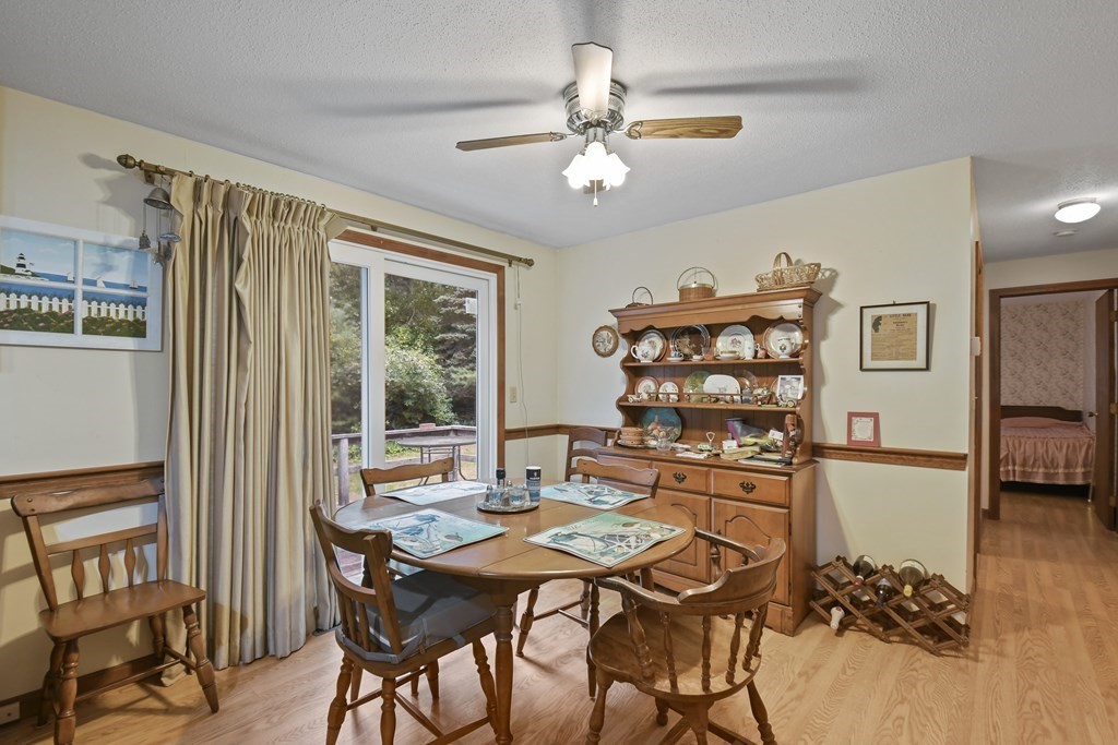 162 Cedric Road Barnstable, MA 02632 - Photo 11 of 29 a view of a dining room with furniture and chandelier