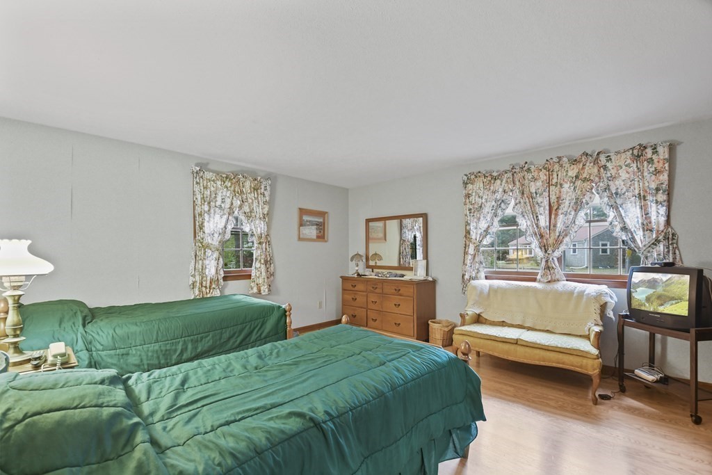 162 Cedric Road Barnstable, MA 02632 - Photo 17 of 29 a bedroom with a bed and a dresser next to a window