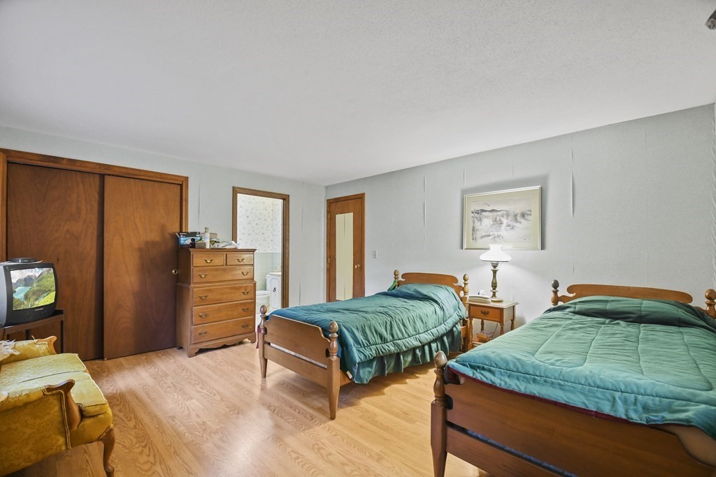 162 Cedric Road Barnstable, MA 02632 - Photo 18 of 29 a bedroom with two beds and a closet