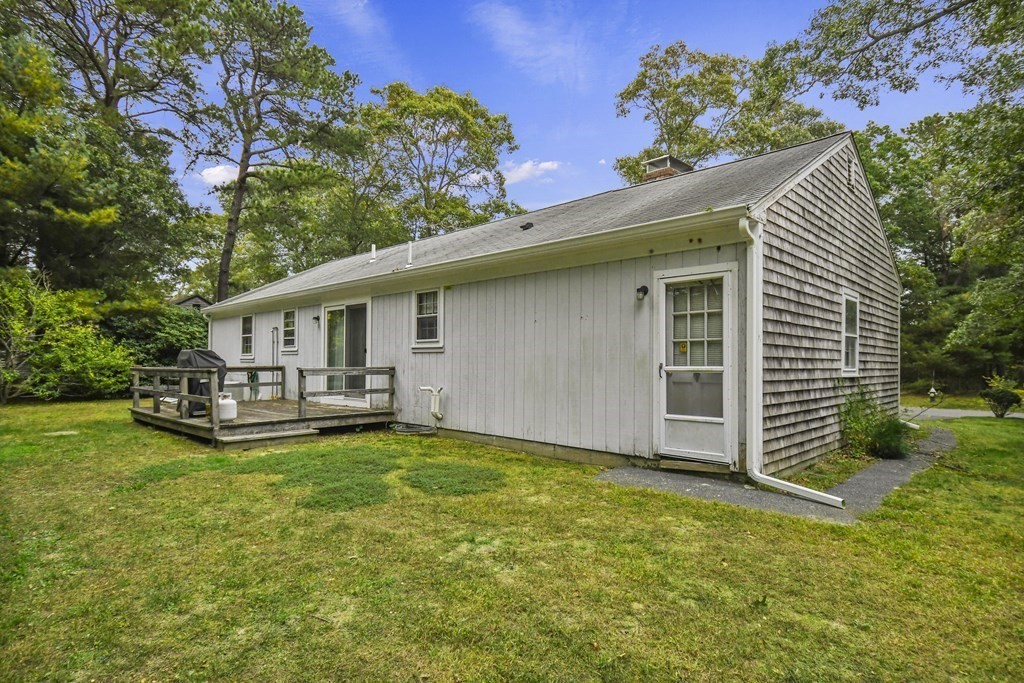 162 Cedric Road Barnstable, MA 02632 - Photo 23 of 29 a view of a house with a yard and sitting area