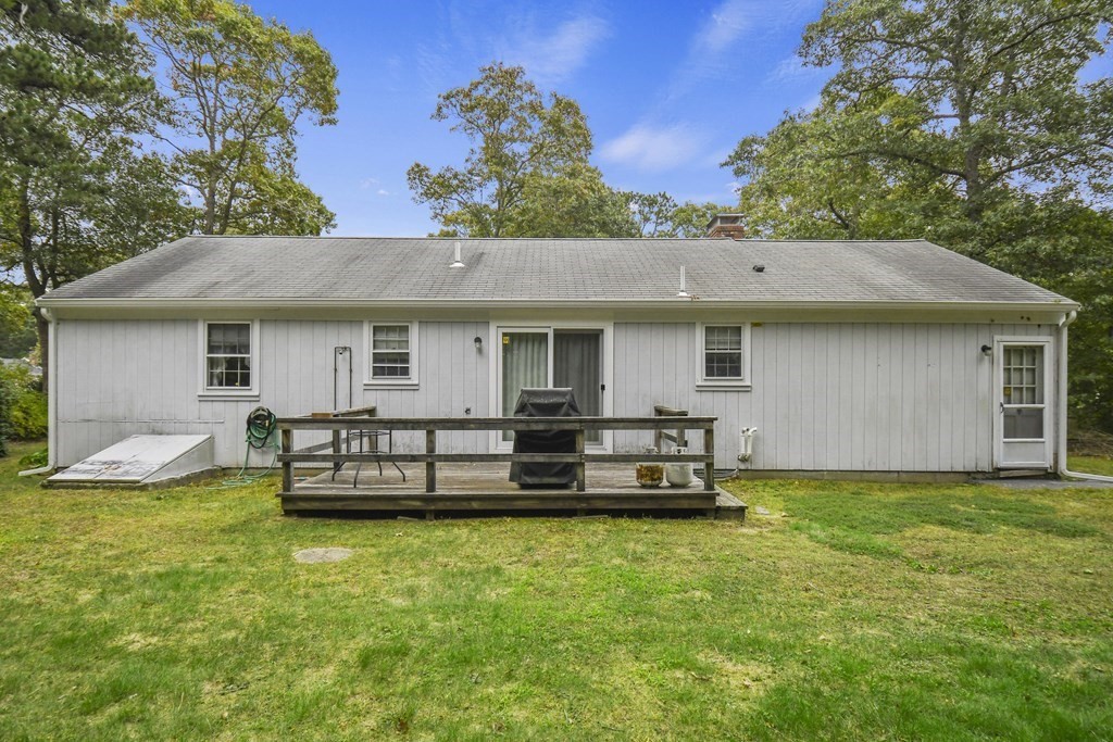 162 Cedric Road Barnstable, MA 02632 - Photo 24 of 29 a view of a house with a yard porch and sitting area