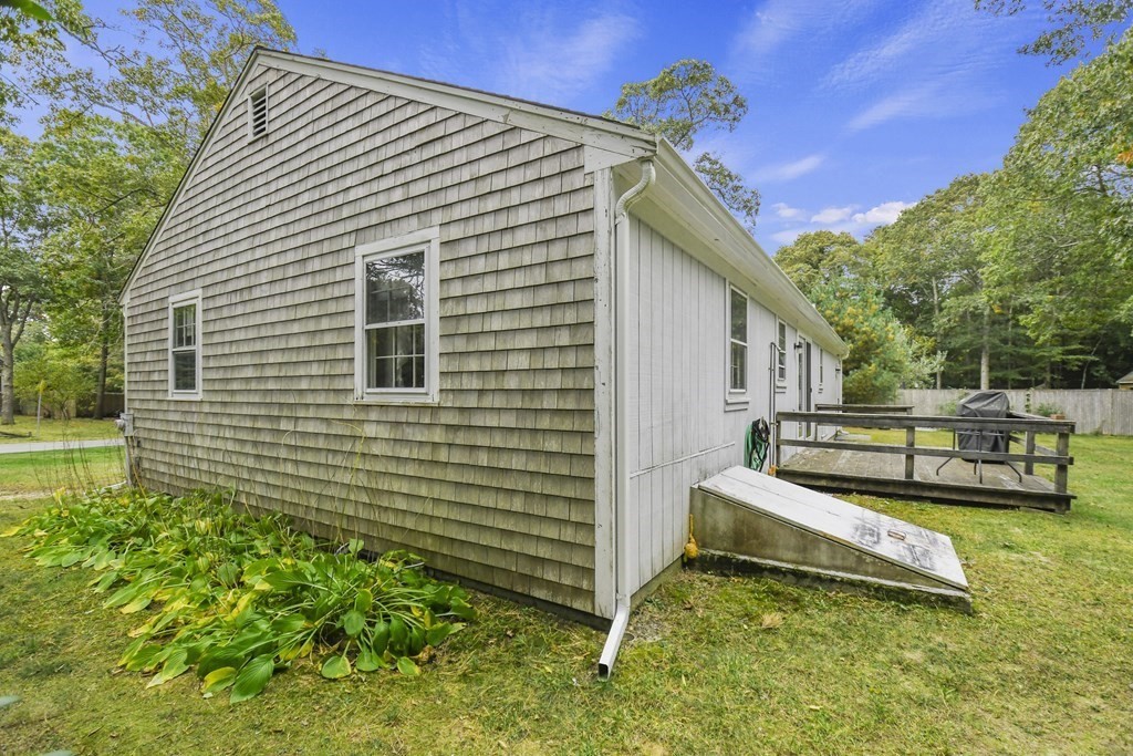 162 Cedric Road Barnstable, MA 02632 - Photo 25 of 29 a view of a house with a yard