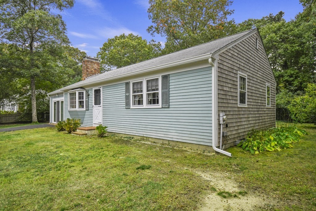 162 Cedric Road Barnstable, MA 02632 - Photo 26 of 29 a backyard of a house with seating space