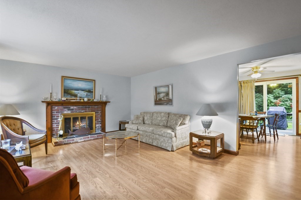 162 Cedric Road Barnstable, MA 02632 - Photo 3 of 29 a living room with furniture and a fireplace