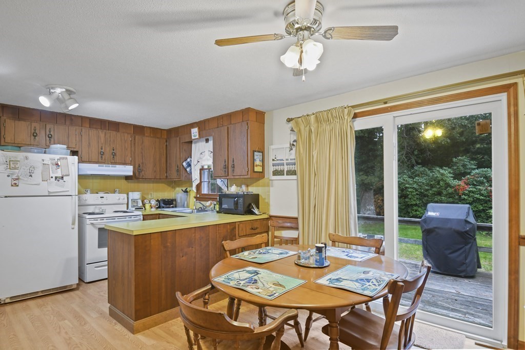 162 Cedric Road Barnstable, MA 02632 - Photo 9 of 29 a view of a dining room with furniture window and wooden floor