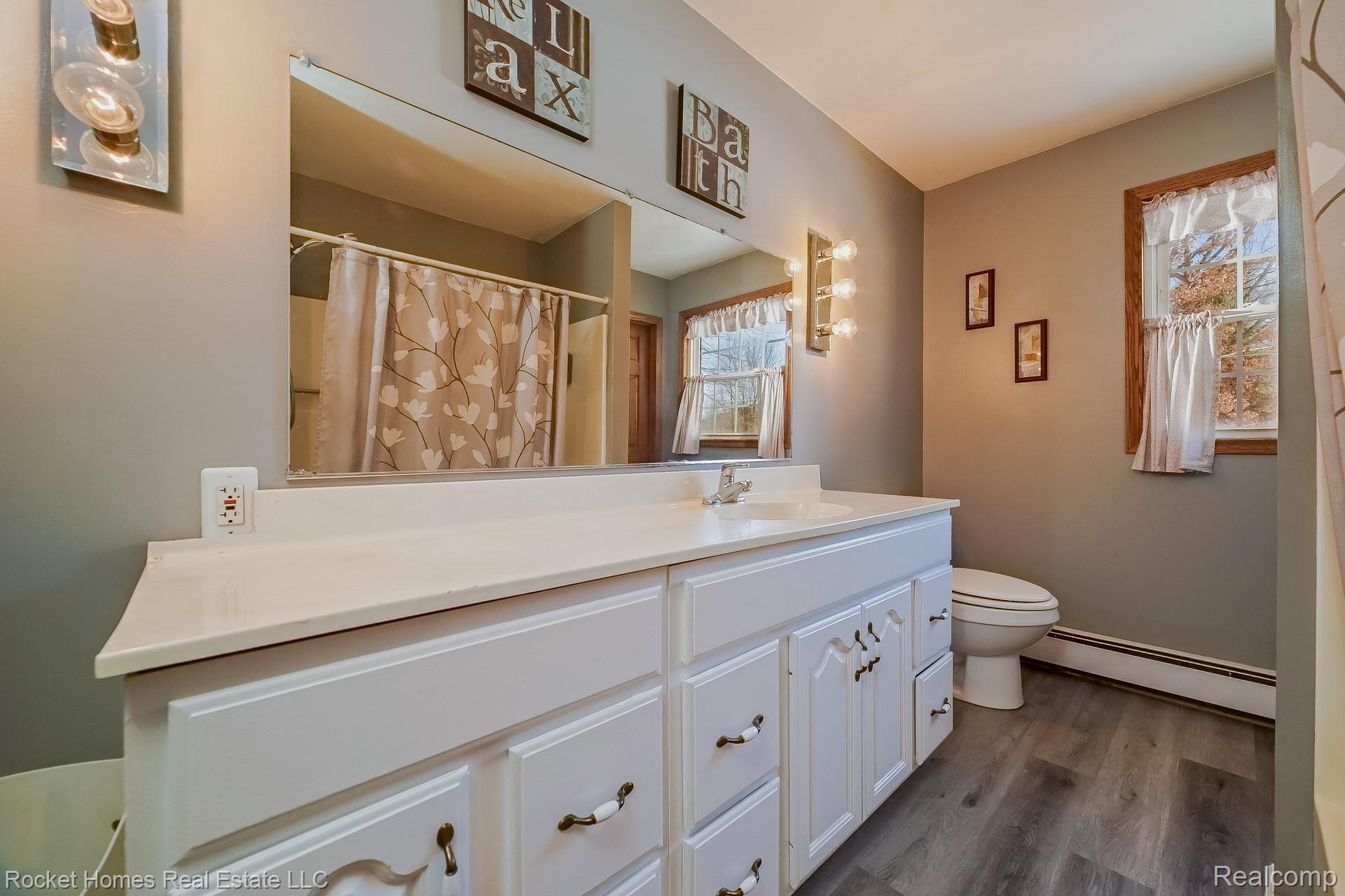 12792 Budd Road Burt, MI 48417 - Photo 20 of 42 019-photo-main-bathroom-8986901.jpg