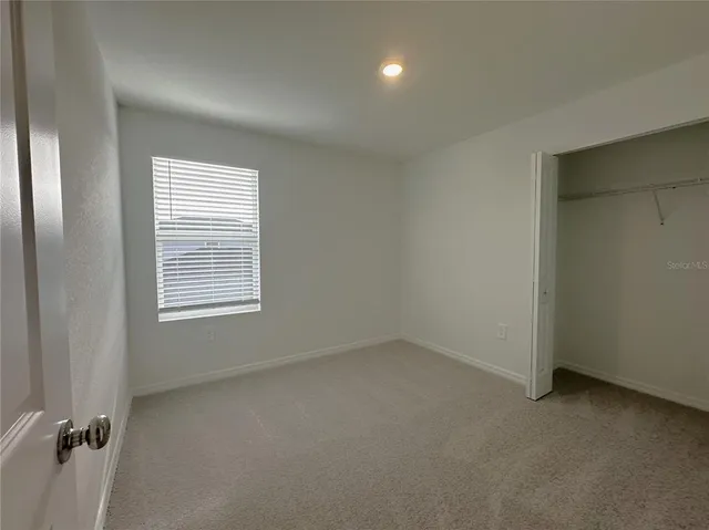 a view of a storage & utility room with a washer dryer
