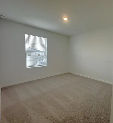 a view of a field with an ocean