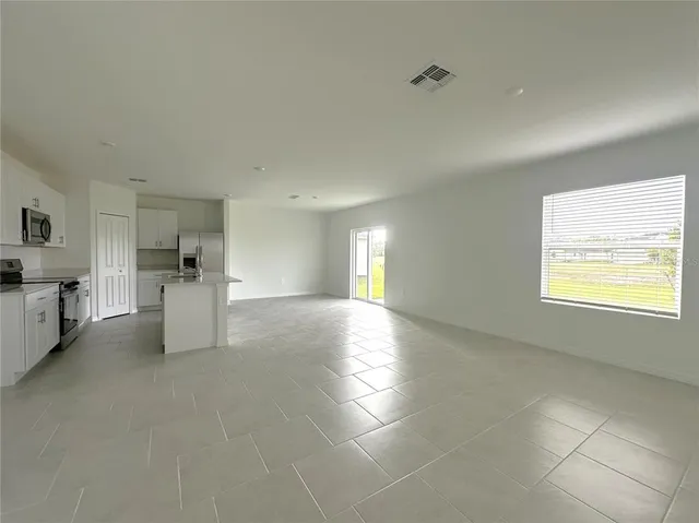 a kitchen with stainless steel appliances a refrigerator sink and stove