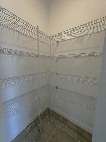 a view of an empty room and a window