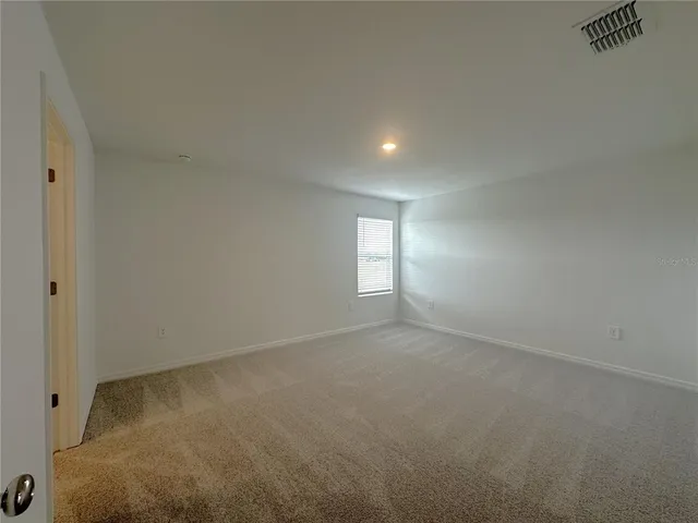 a bathroom with a shower and a sink