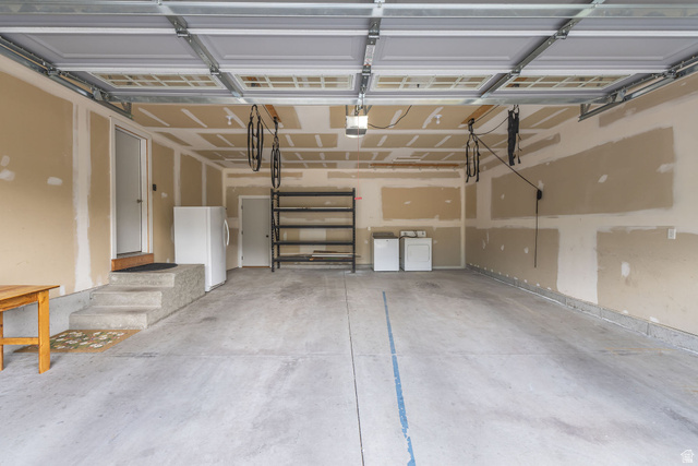 1552 Sumac Drive Logan, UT 84321 - Photo 51 of 72 Spacious garage featuring a concrete floor, overhead lighting, and interior access