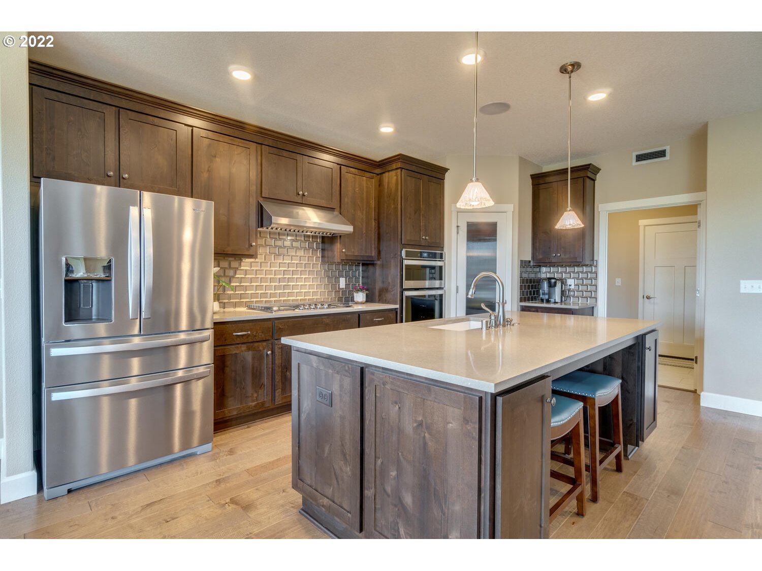 4326 South 11th Way Ridgefield, WA 98642 - Photo 11 of 26 a kitchen with a refrigerator a sink and dishwasher