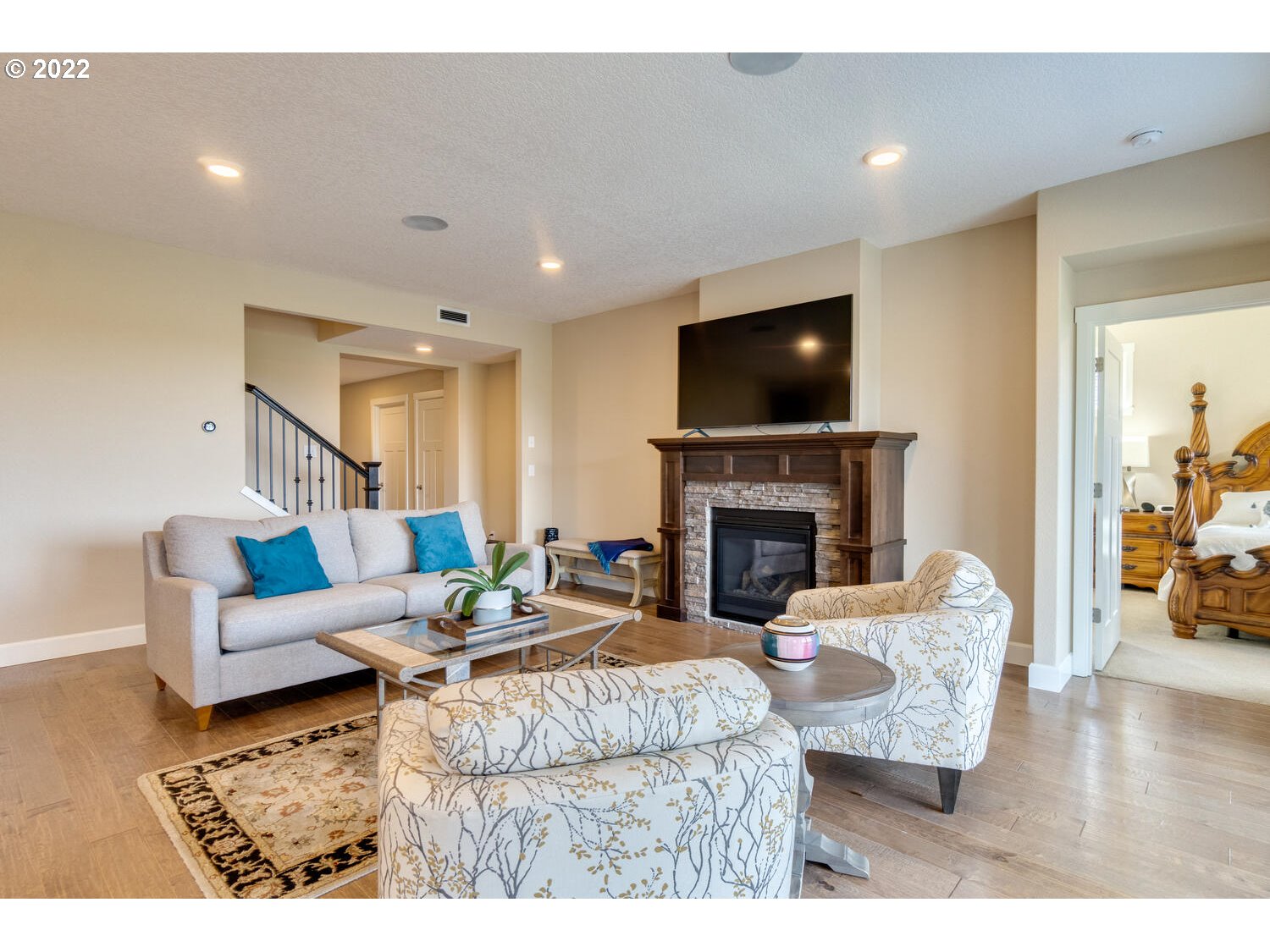4326 South 11th Way Ridgefield, WA 98642 - Photo 14 of 26 a living room with fireplace furniture and a flat screen tv