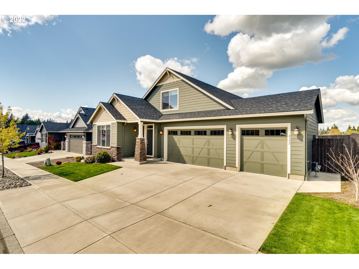 4326 South 11th Way Ridgefield, WA 98642 - Photo 2 of 26 a front view of a house with a yard and garage