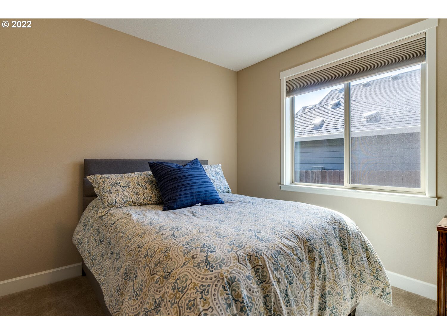 4326 South 11th Way Ridgefield, WA 98642 - Photo 7 of 26 a bed sitting in a bedroom next to a window