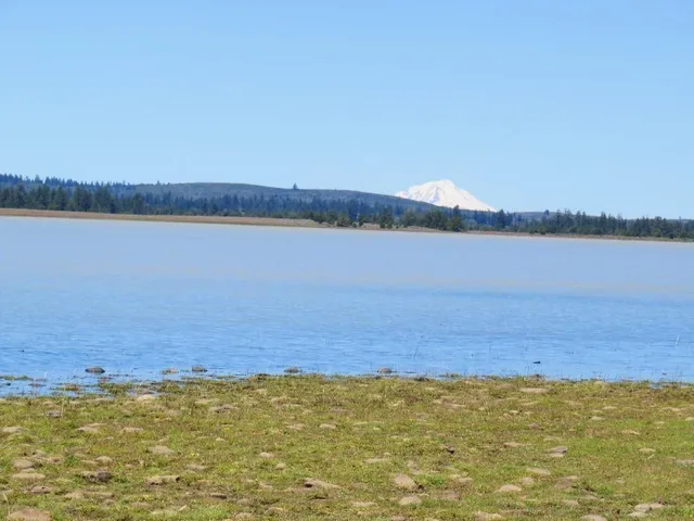 a view of a lake and mountain in back