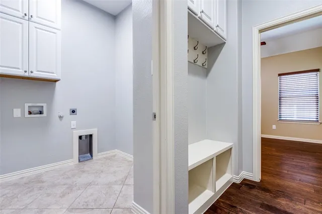 a view of a hallway to a bedroom and wooden floor
