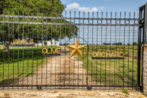 a view of a balcony with a iron gate