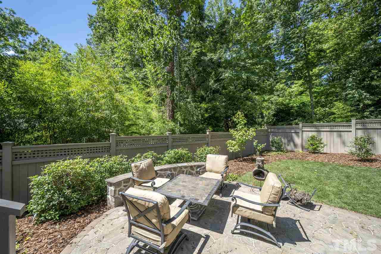 1007 Gardner Street Raleigh, NC 27607 - Photo 3 of 3 a view of backyard with outdoor seating and lake