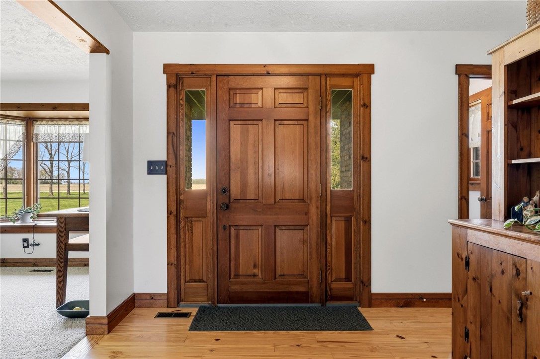 4971 Lackey Road Cedarville, OH 45314 - Photo 16 of 79 The welcoming entrance features beautiful wood details and abundant natural light.